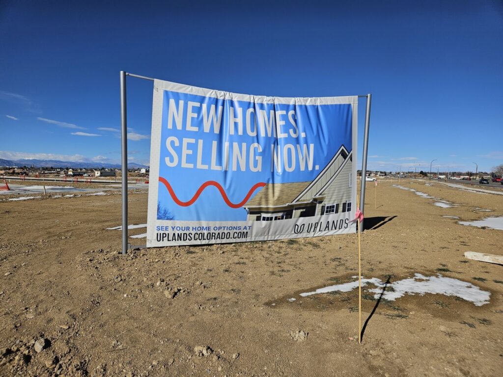 New homes now selling sign at Uplands